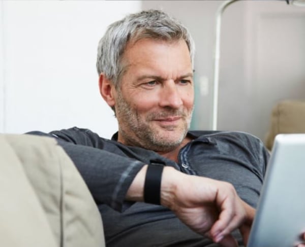 Man sofa tablet