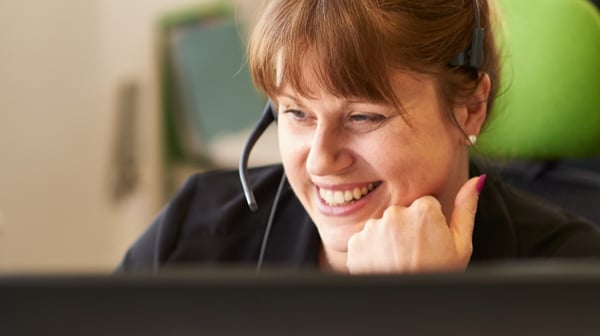 Woman having online meeting with headset