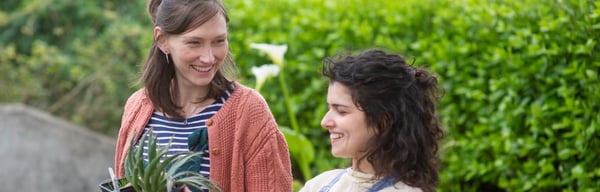Image showing two women holding a plant