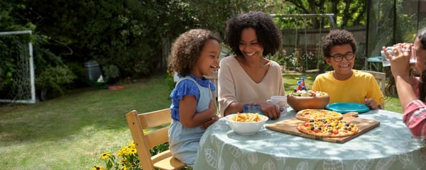 Family enjoying a meal outside