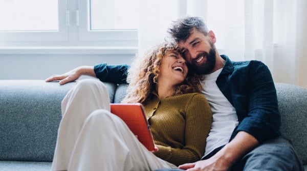 Young couple sitting on the sofa
