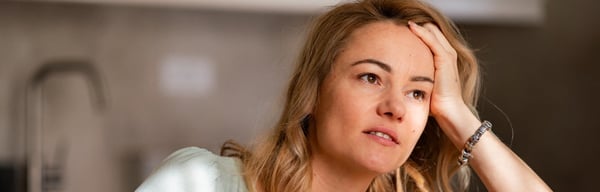 Image of a woman looking stressed