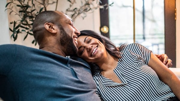 Older couple smiling and embracing