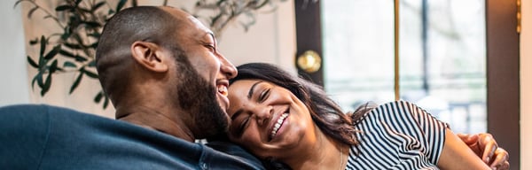 Older couple smiling and embracing