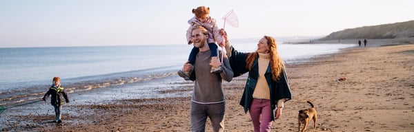 Family walking along the beach