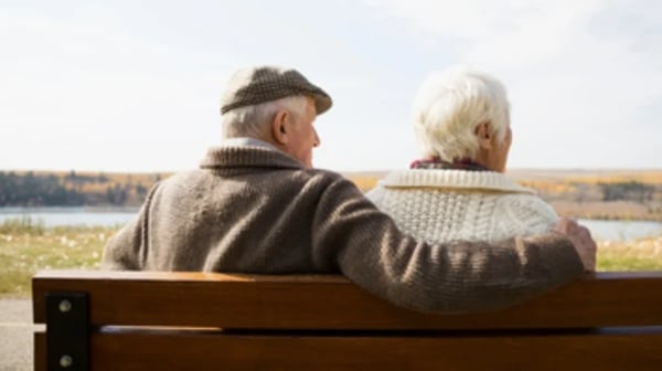 Older couple sitting on bench
