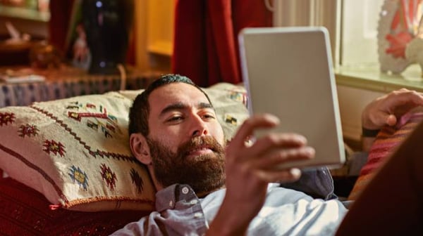 Man looking at tablet