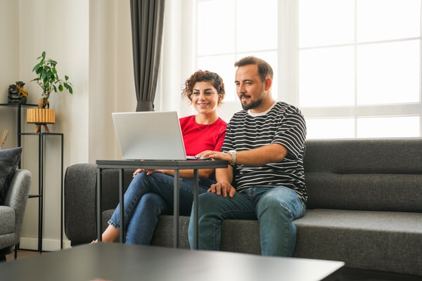 Couple chatting to adviser on video call