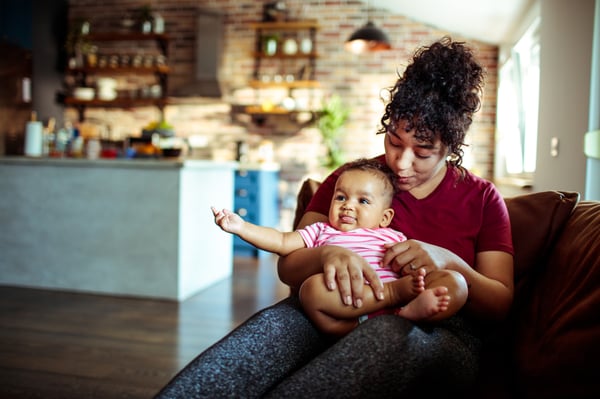 Mother and baby on the sofa cuddling
