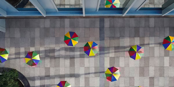 L&G Umbrellas on a tiled courtyard