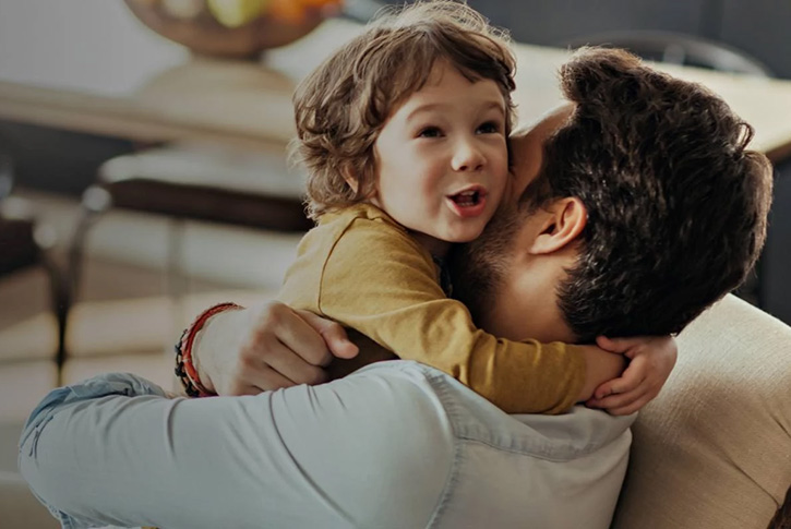 father holding child