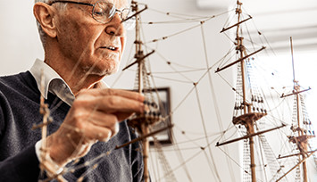 elderly-man-with-model-ship_Feature_box_355px