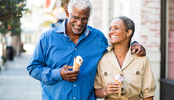 Older couple walking with ice cream_Link_block_table_355px.jpg