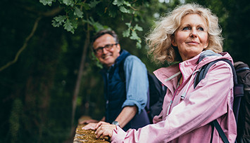 older_couple_walking_in_woods_Feature_box_355px.jpg