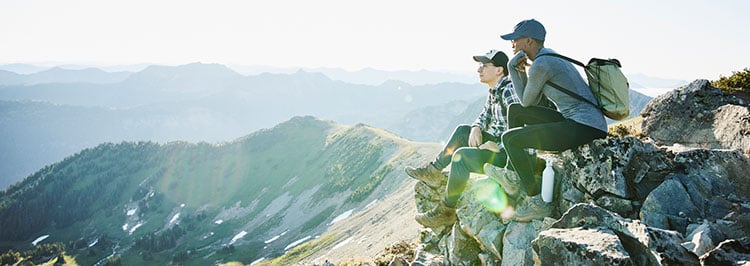 Hikers resting on a mountain ridge