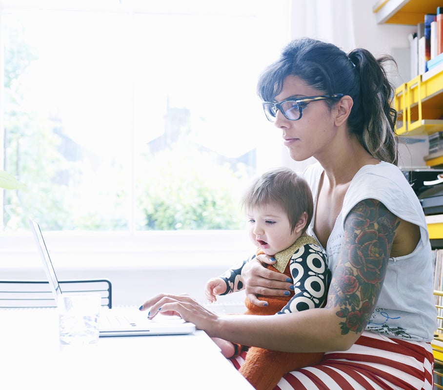 mother and child using laptop