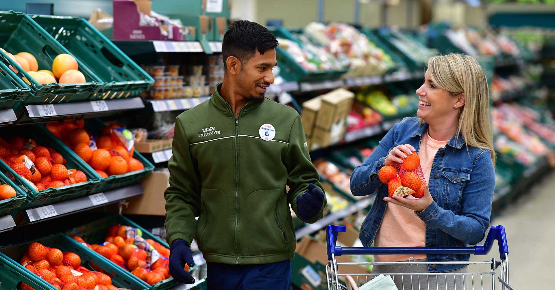 Tesco colleague chatting to a customer in store