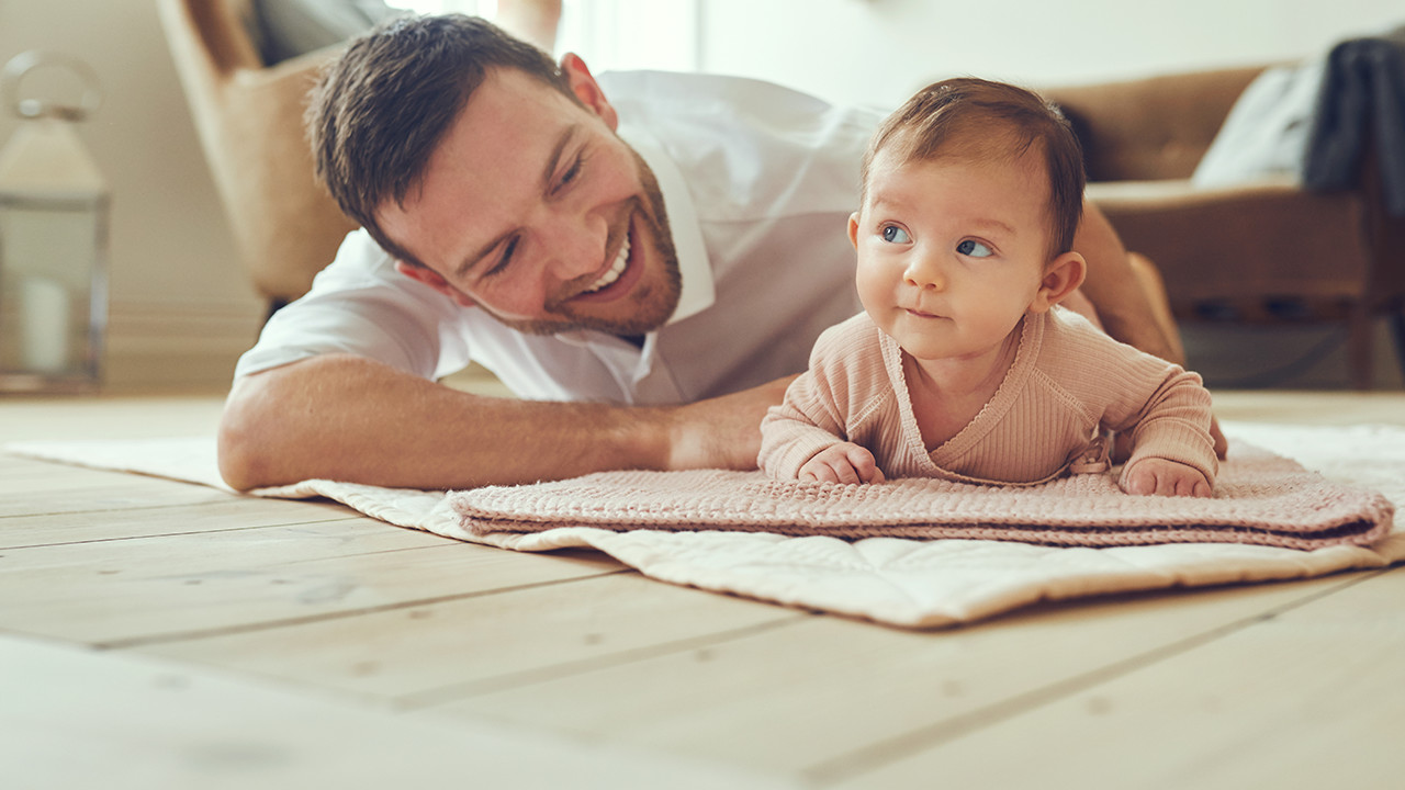 father-baby-smiling-on-floor_Banner_Block_1280px