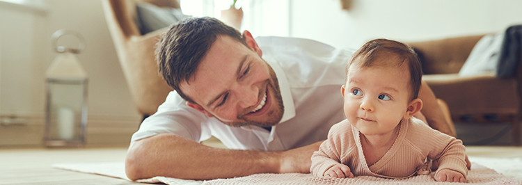 father-baby-smiling-on-floor_Feature_box_with_image_750px
