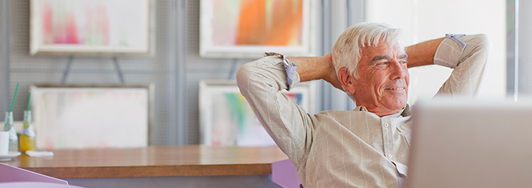 Older man looking out window