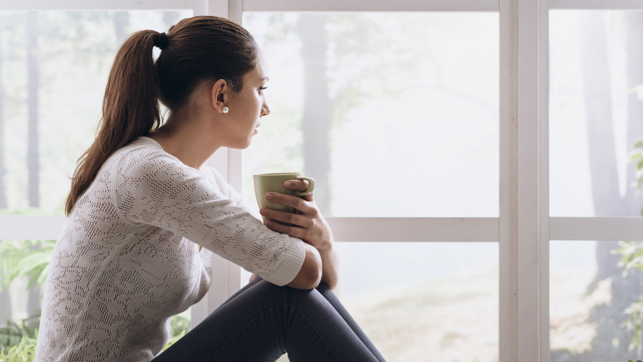 Woman staring out the window