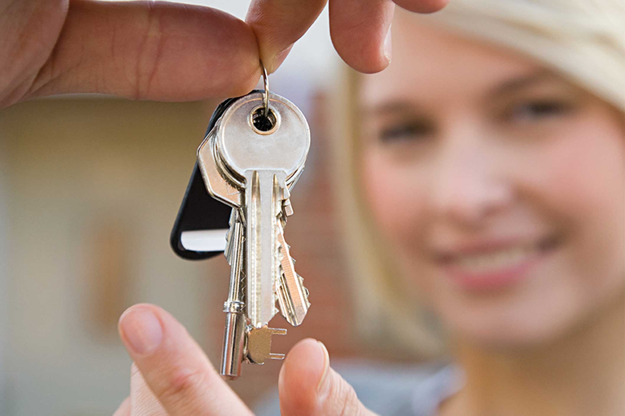 Woman holding house keys