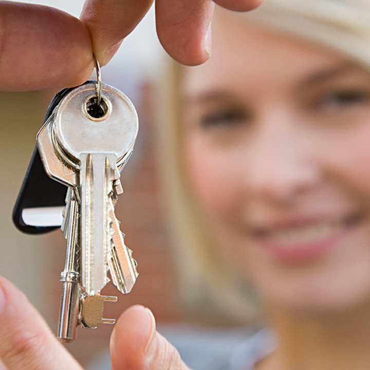 Woman holding house keys