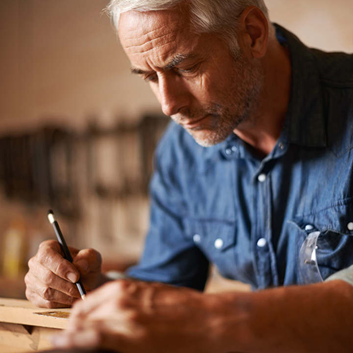 Man drawing in workshop