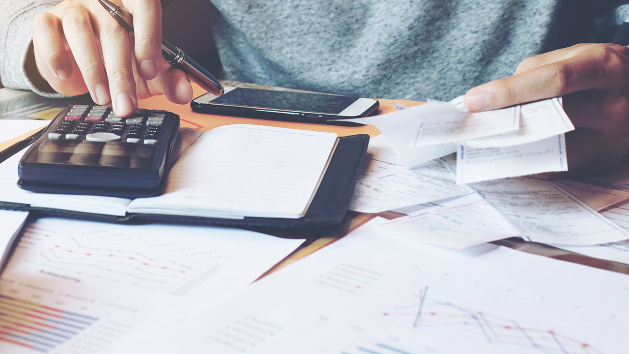 Man using calculator