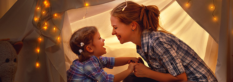 mother and daughter in tent at home_Feature_box_with_image_750px