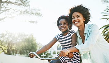 mother with daughter on bicycle_Link_block_table_355px