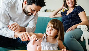 child-learning-to-save-piggy-bank_Link_block_table_355px
