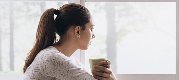 Woman holding cup
