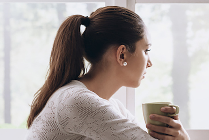 Woman holding cup