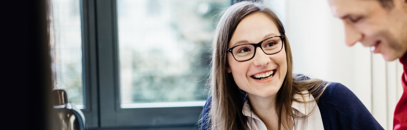 Smiling woman in meeting