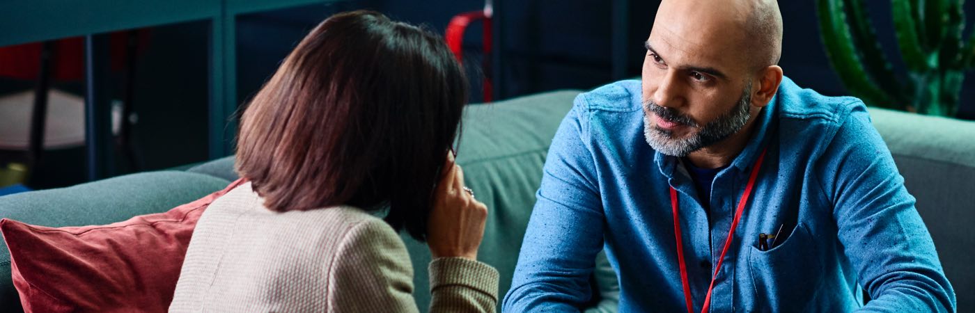 Couple chatting on sofa