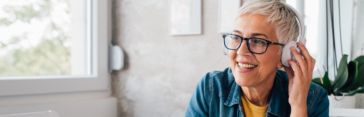 Older woman wearing headphones