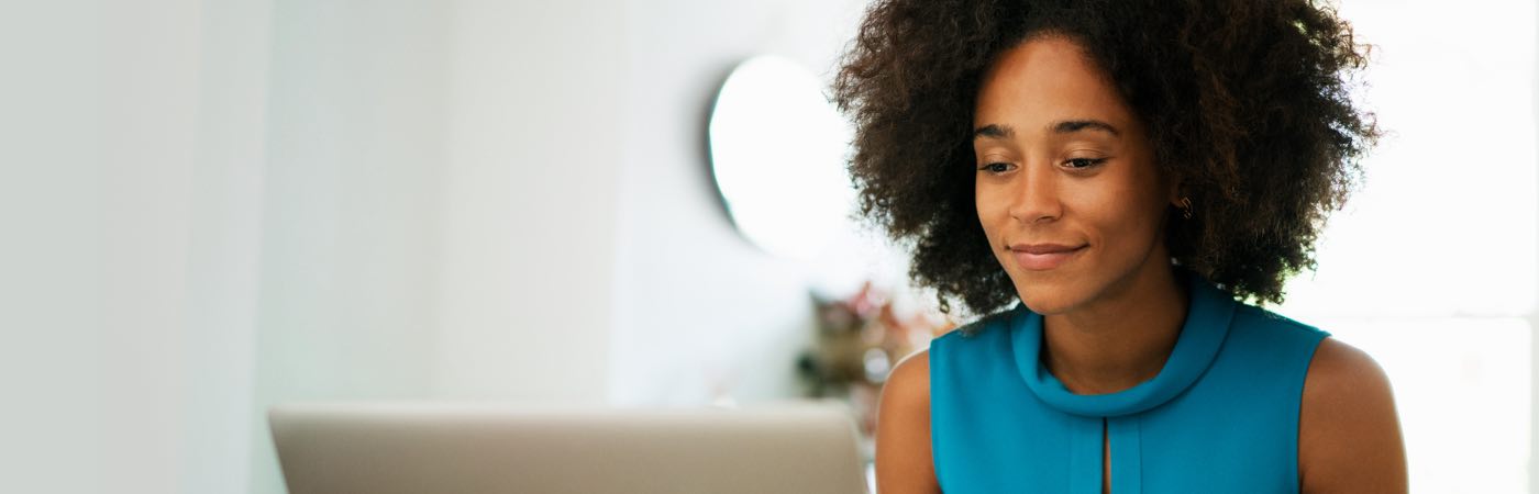 Young woman looking at laptop