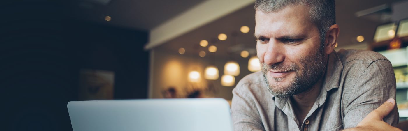 Man reading from laptop