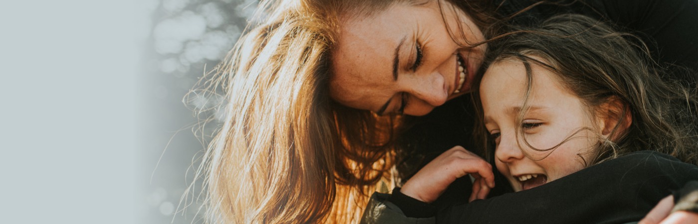 Woman hugging child