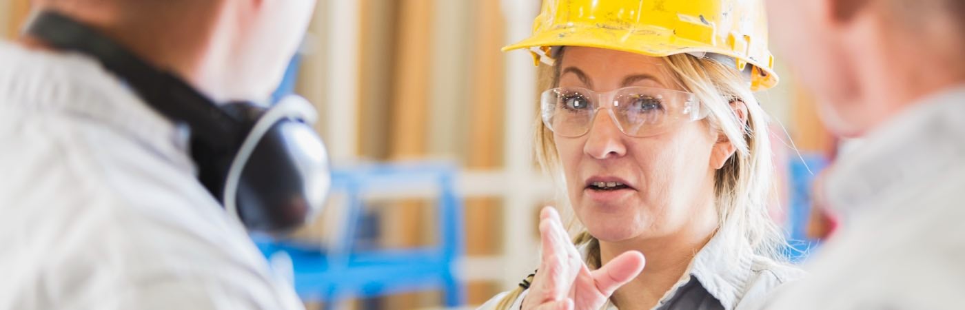 Woman in construction helmet