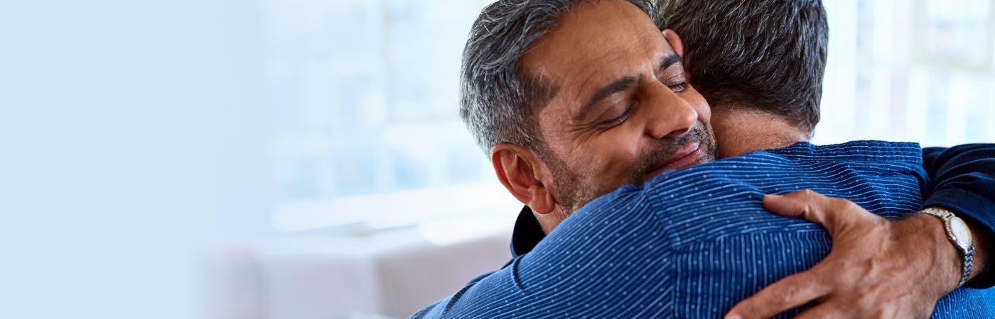 Father and son hugging