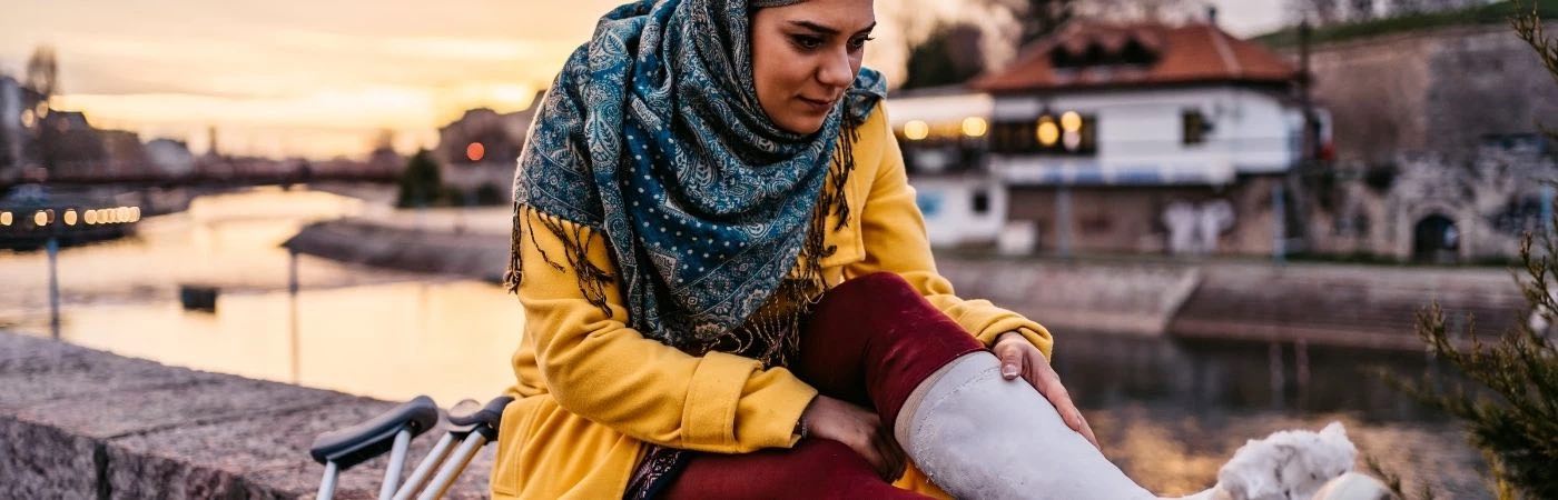 Woman with plaster cast on leg