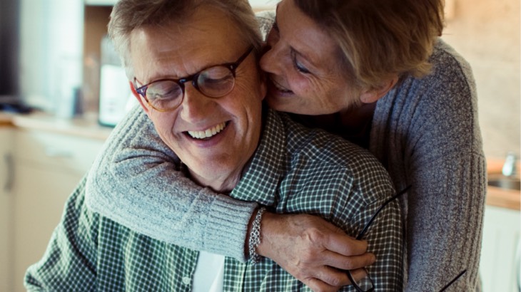 Woman hugging man