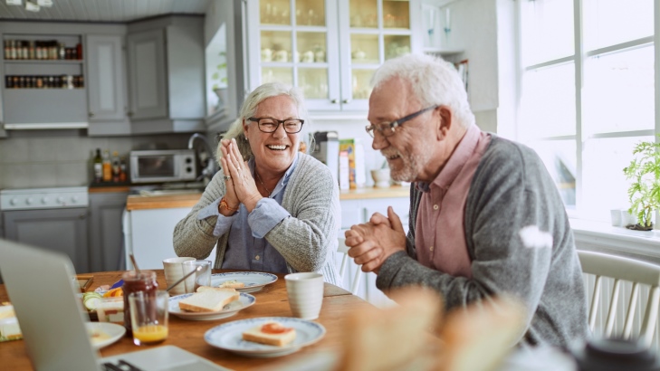Elderly couple at a table