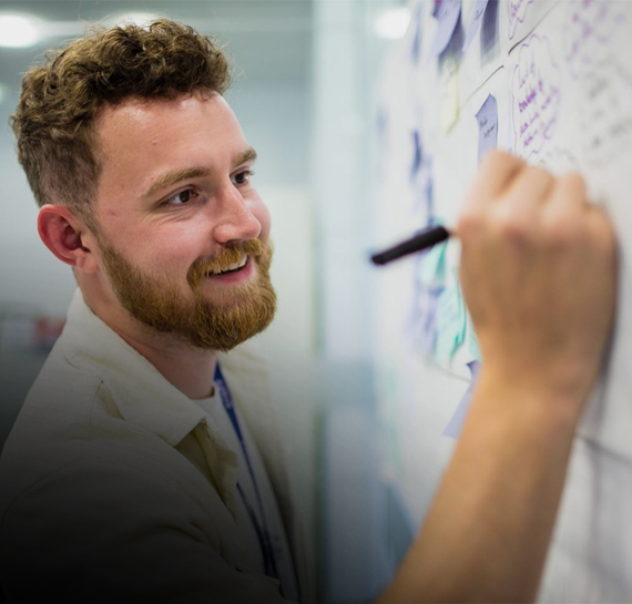 Person writing on a whiteboard