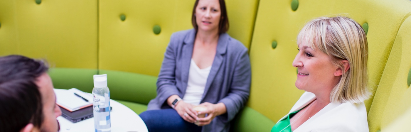 Colleagues taking part in a relaxed meeting
