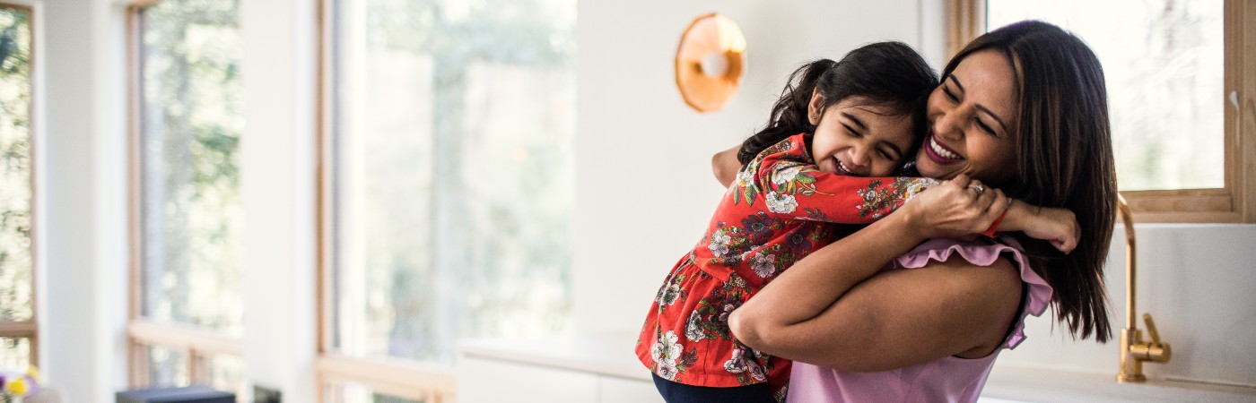 Woman hugging child