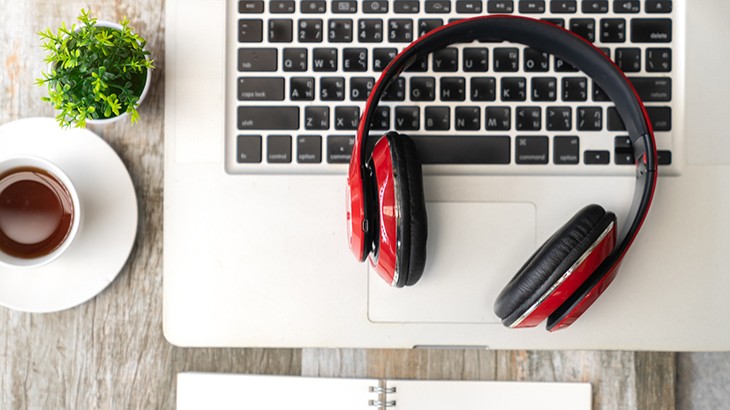 Headphones and laptop on a desk