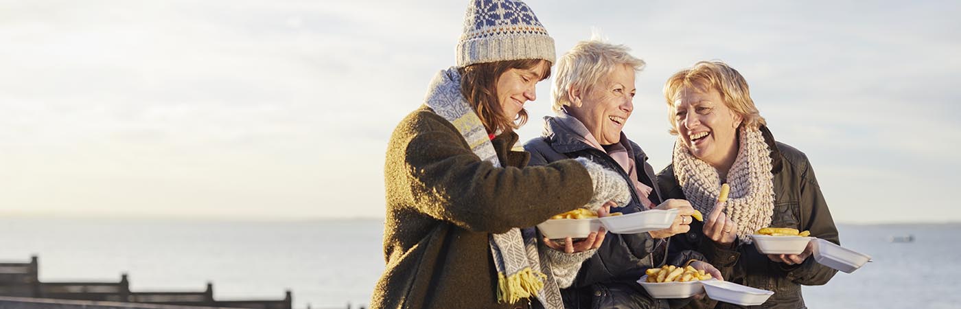 Women eating fish and chips